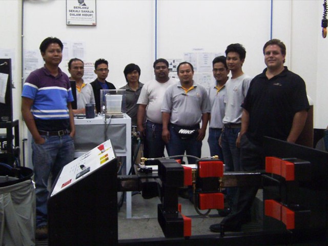 Galiso's Rick Wright with the crew at Destini Berhad, Malaysia